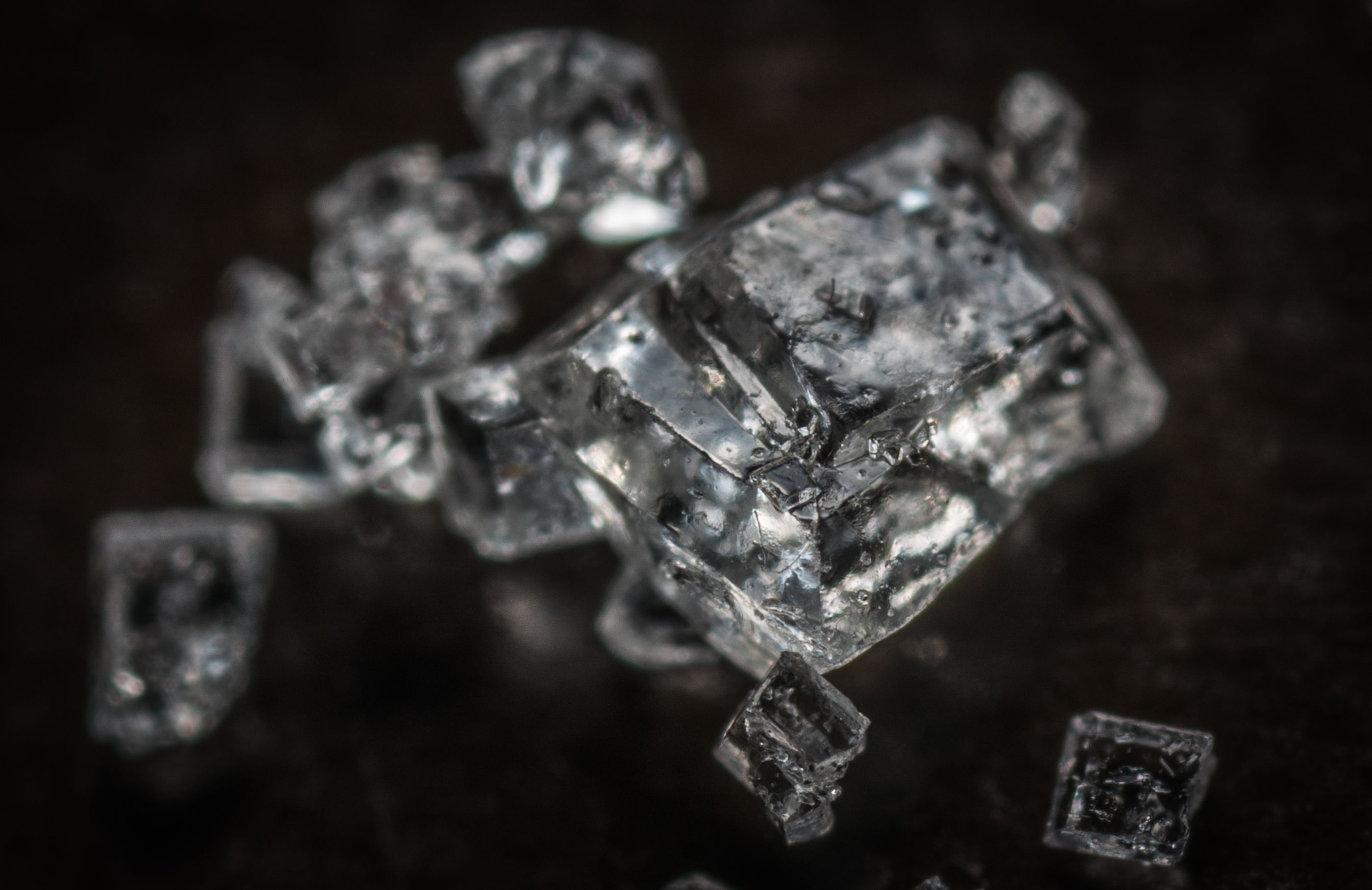 Macro shot of clear crystal cubes showcasing intricate details and textures.